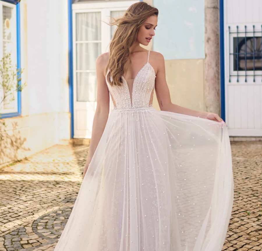 Model wearing a white gown by Maggie Sottero