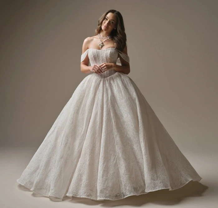 Model wearing a white gown by Maggie Sottero