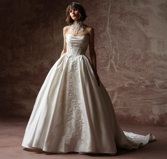 Model wearing a white gown by Sottero And Midgley