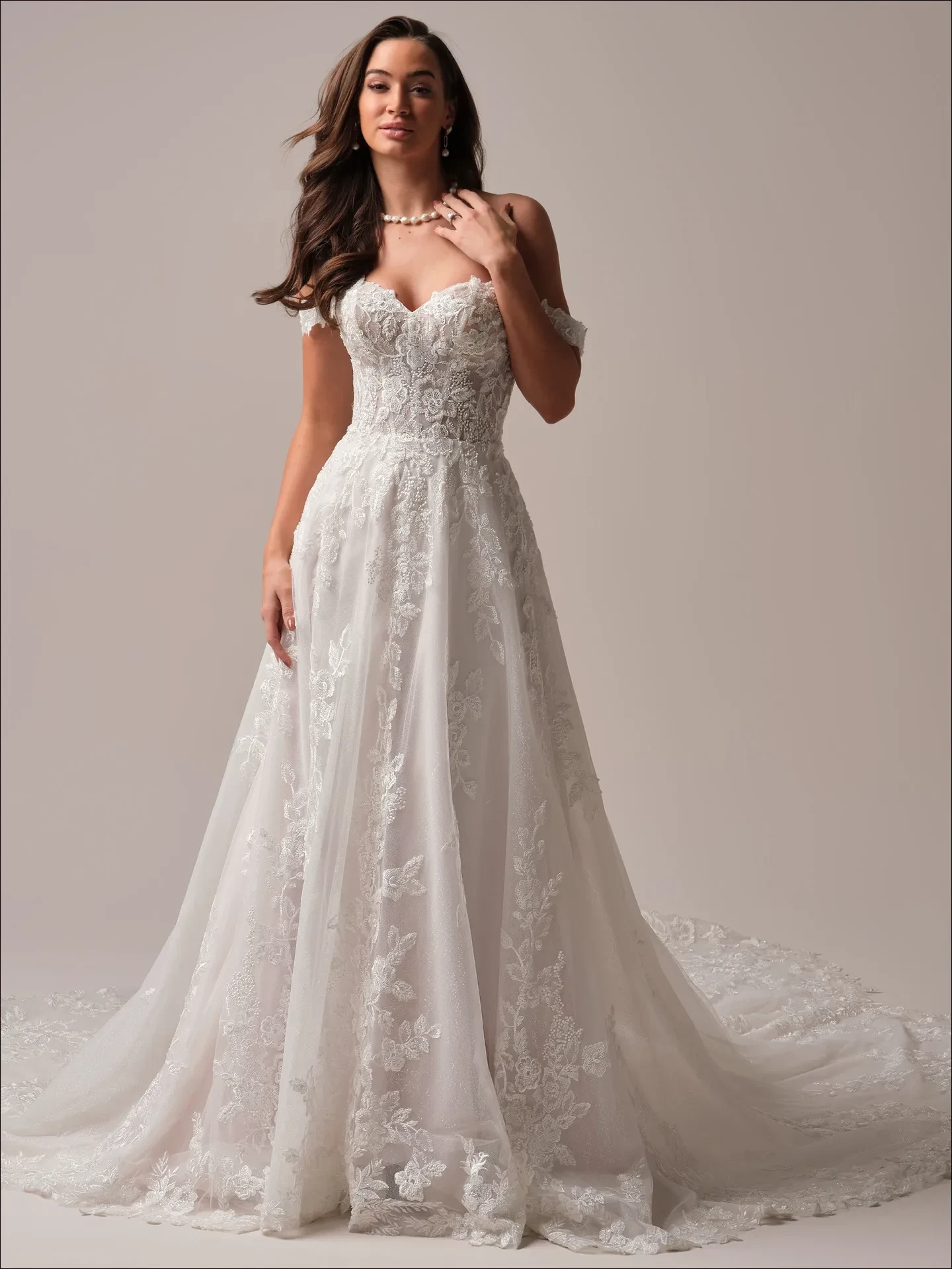 Model wearing a white gown by Maggie Sottero