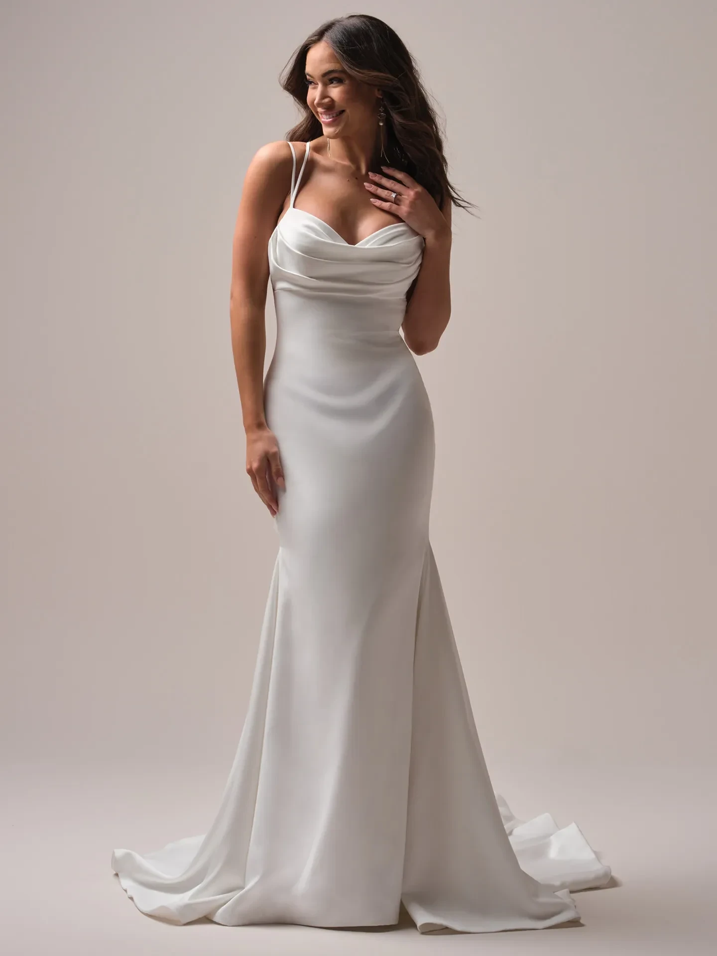 Model wearing a white gown by Rebecca Ingram