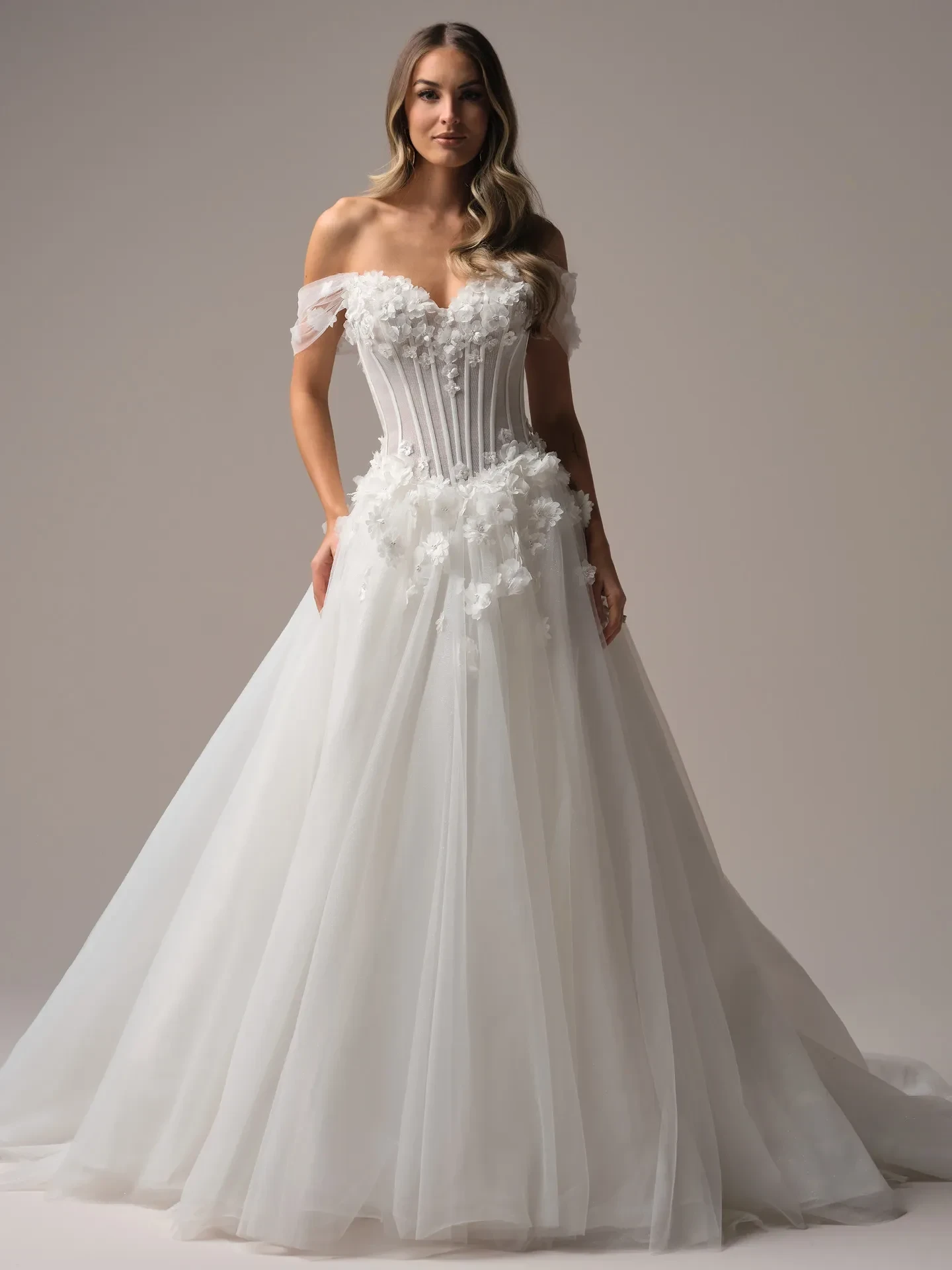 Model wearing a white gown by Sottero And Midgley